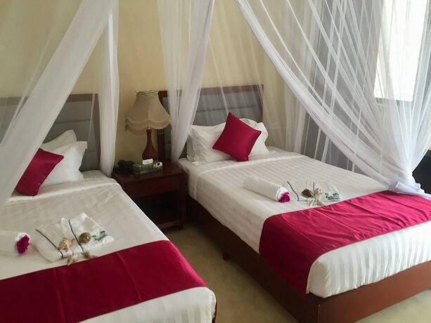 Imagen de la habitación del Hotel Mandhari Villa. Foto 21