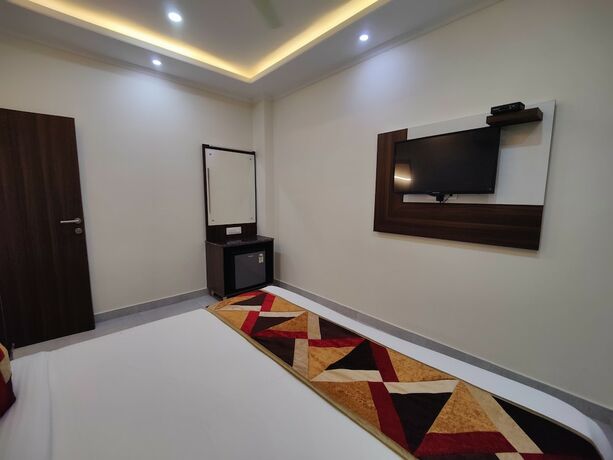 Imagen de la habitación del Hotel Mandi Heights. Foto 11