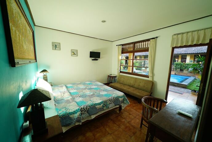 Imagen de la habitación del Hotel Mangga Bungalow. Foto 19