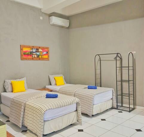 Imagen de la habitación del Hotel Manggolo Homestay Syariah. Foto 13