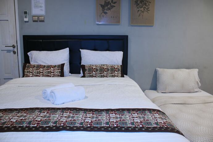 Imagen de la habitación del Hotel Manggolo Homestay Syariah. Foto 15