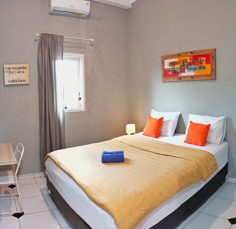 Imagen de la habitación del Hotel Manggolo Homestay Syariah. Foto 19