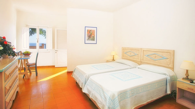 Imagen de la habitación del Hotel Mangia's Sardinia Resort. Foto 4