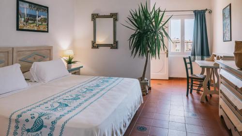 Imagen de la habitación del Hotel Mangia's Sardinia Resort. Foto 12