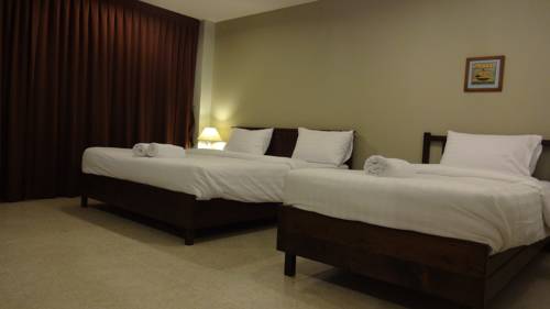 Imagen de la habitación del Hotel Mango Bedroom Inn. Foto 15