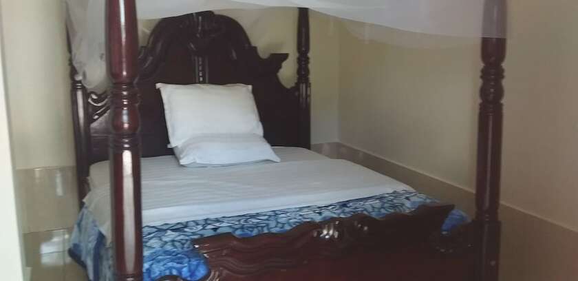 Imagen de la habitación del Hotel Mango Cottages and Recreation Center. Foto 19