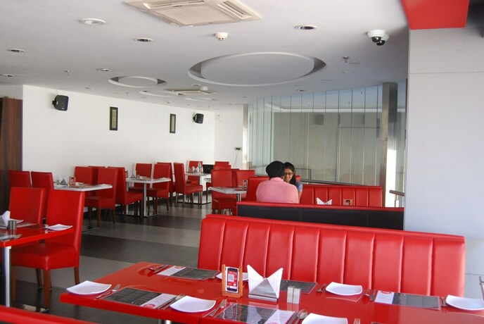 Imagen del bar/restaurante del Hotel Mango Hotels Tune, Ahmedabad. Foto 15