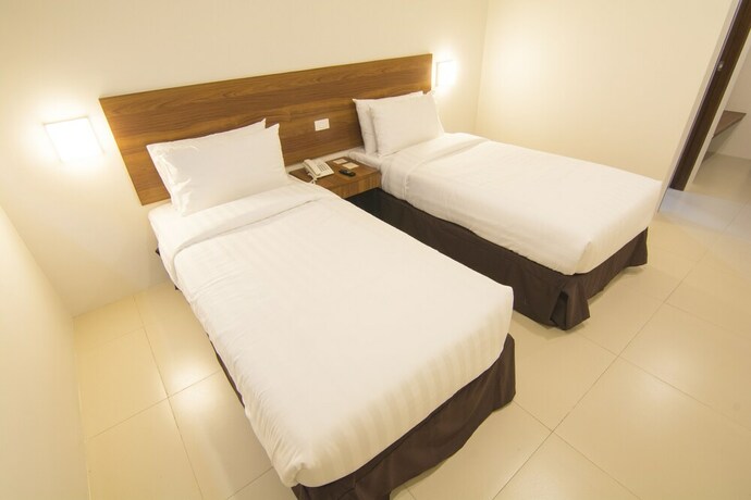 Imagen de la habitación del Hotel Mango Suites Cauayan. Foto 15