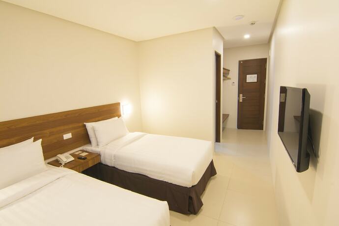 Imagen de la habitación del Hotel Mango Suites Cauayan. Foto 19
