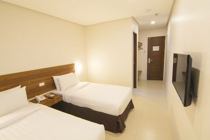 Imagen de la habitación del Hotel Mango Suites Cauayan. Foto 31