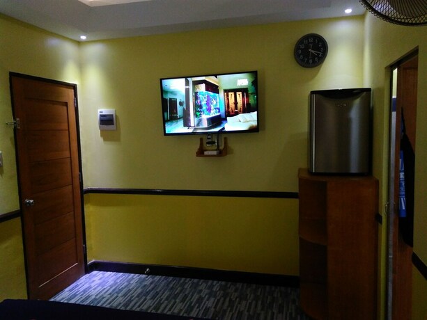 Imagen de la habitación del Hotel Mango's Beachfront Resort. Foto 16