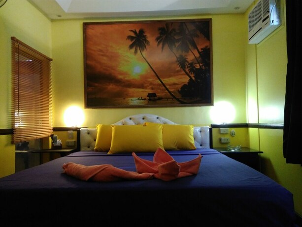 Imagen de la habitación del Hotel Mango's Beachfront Resort. Foto 21