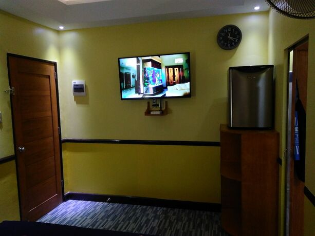 Imagen de la habitación del Hotel Mango's Beachfront Resort. Foto 23