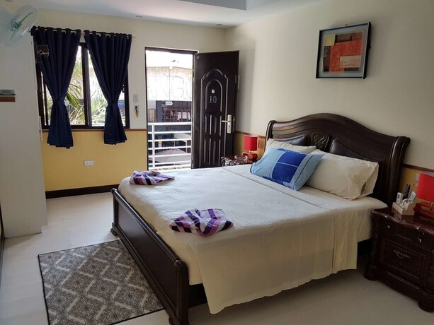 Imagen de la habitación del Hotel Mango's Beachfront Resort. Foto 27