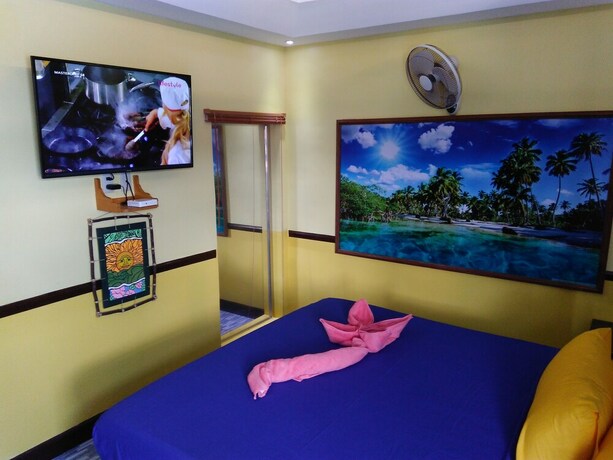 Imagen de la habitación del Hotel Mango's Beachfront Resort. Foto 28