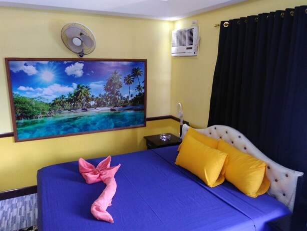 Imagen de la habitación del Hotel Mango's Beachfront Resort. Foto 29