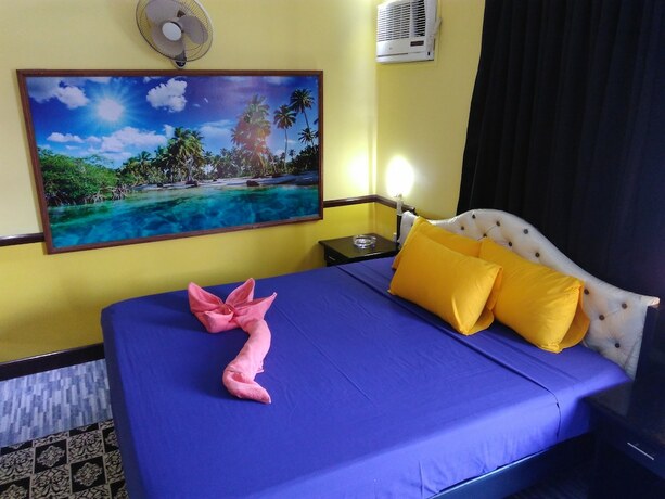 Imagen de la habitación del Hotel Mango's Beachfront Resort. Foto 34