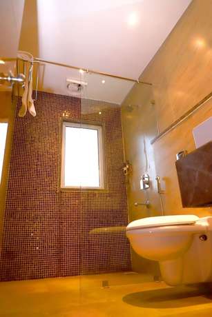 Imagen de la habitación del Hotel Mangos Haridwar. Foto 11