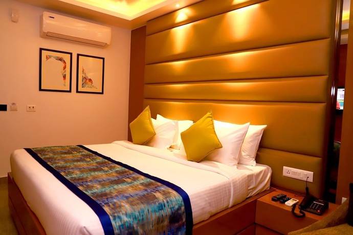 Imagen de la habitación del Hotel Mangos Haridwar. Foto 12