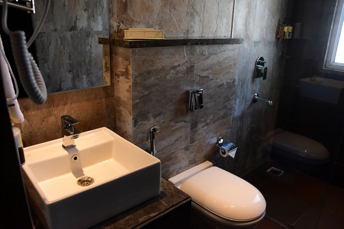 Imagen de la habitación del Hotel Mangos Haridwar. Foto 13