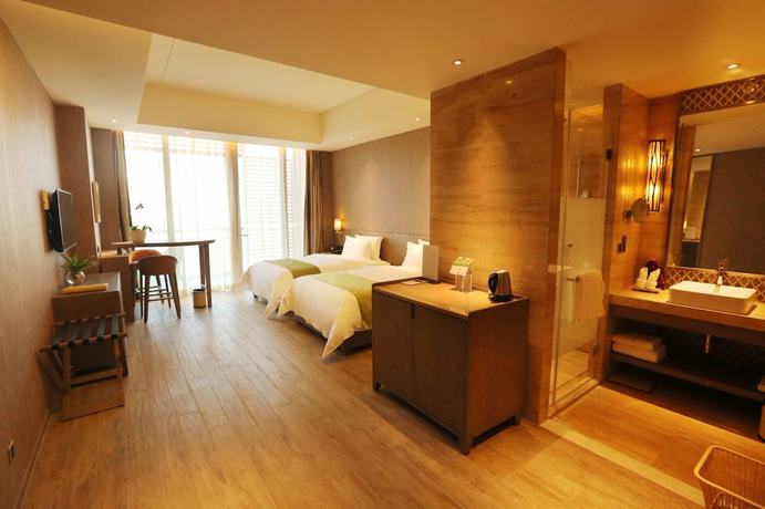 Imagen de la habitación del Hotel Mangrove Tree Resort World Qingdao. Foto 8