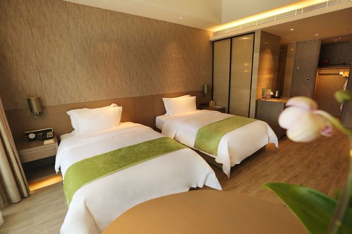 Imagen de la habitación del Hotel Mangrove Tree Resort World Qingdao. Foto 9