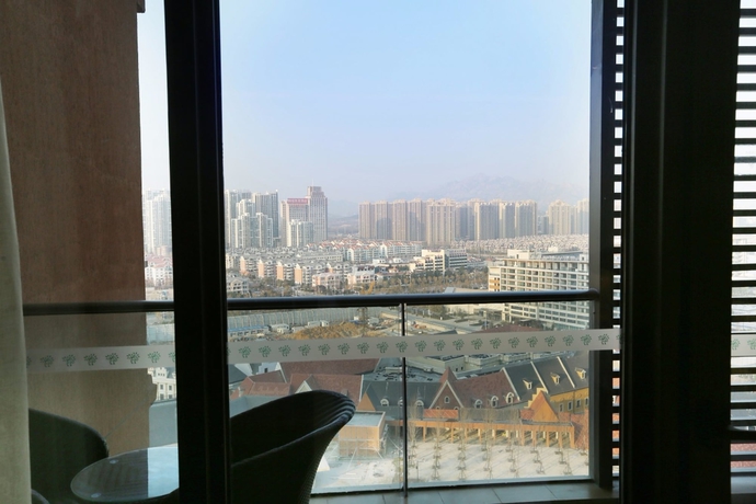 Imagen de la habitación del Hotel Mangrove Tree Resort World Qingdao. Foto 14