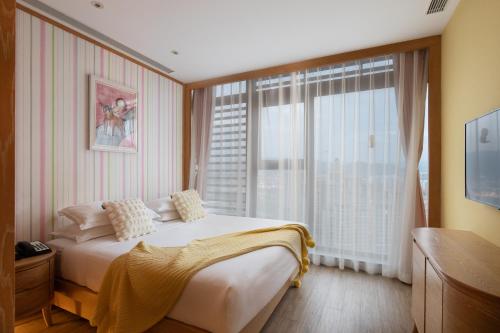 Imagen de la habitación del Hotel Mangrove Tree Resort World Sanya Bay -Elader Palm Tower. Foto 5