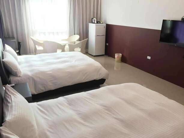 Imagen de la habitación del Hotel Mangyi Inn. Foto 27