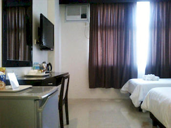 Imagen de la habitación del Hotel Manhattan Suites Inn. Foto 7