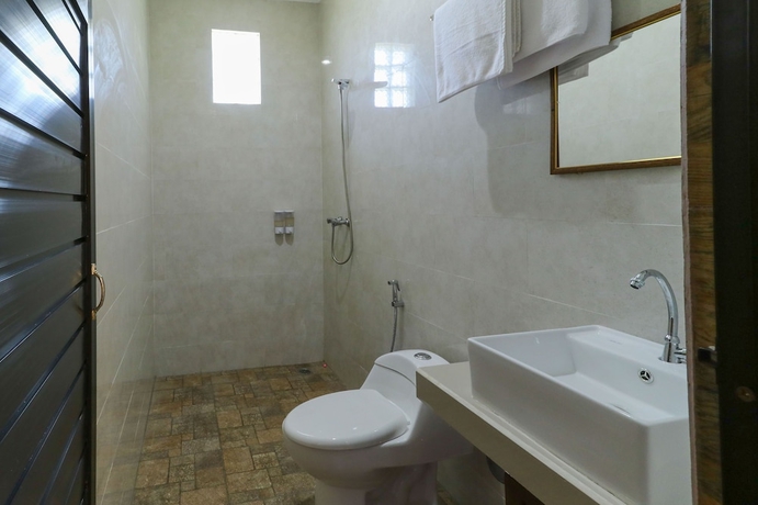 Imagen de la habitación del Hotel Manik Homestay. Foto 16
