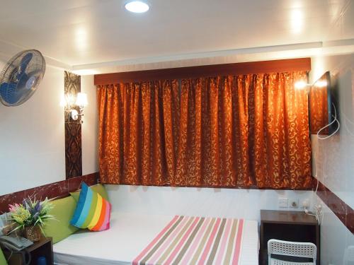 Imagen de la habitación del Hotel Manila Lounge, Kowloon. Foto 6