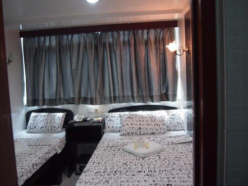 Imagen de la habitación del Hotel Manila Lounge, Kowloon. Foto 7