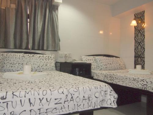 Imagen de la habitación del Hotel Manila Lounge, Kowloon. Foto 8