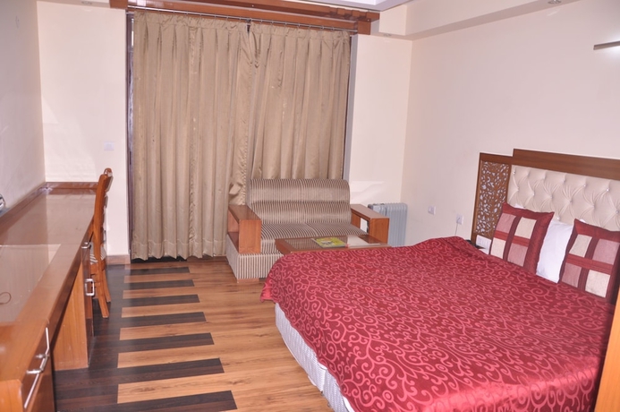 Imagen de la habitación del Hotel Manla Homes Resort. Foto 2