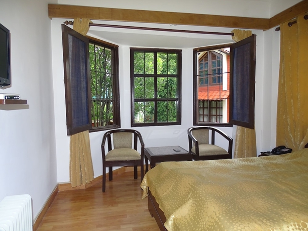Imagen de la habitación del Hotel Manla Homes Resort. Foto 6