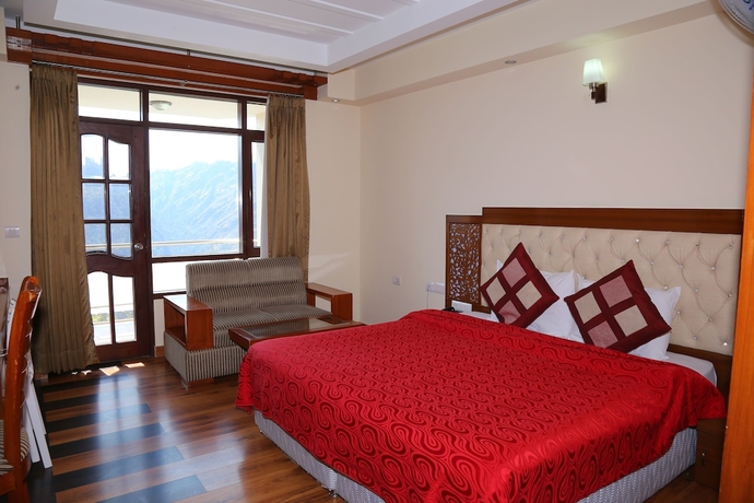 Imagen de la habitación del Hotel Manla Homes Resort. Foto 8