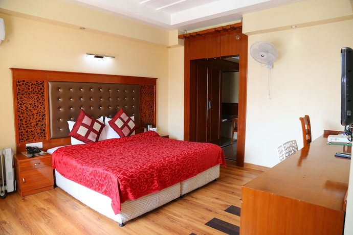 Imagen de la habitación del Hotel Manla Homes Resort. Foto 9
