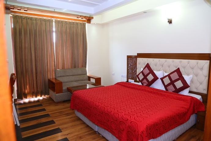 Imagen de la habitación del Hotel Manla Homes Resort. Foto 10