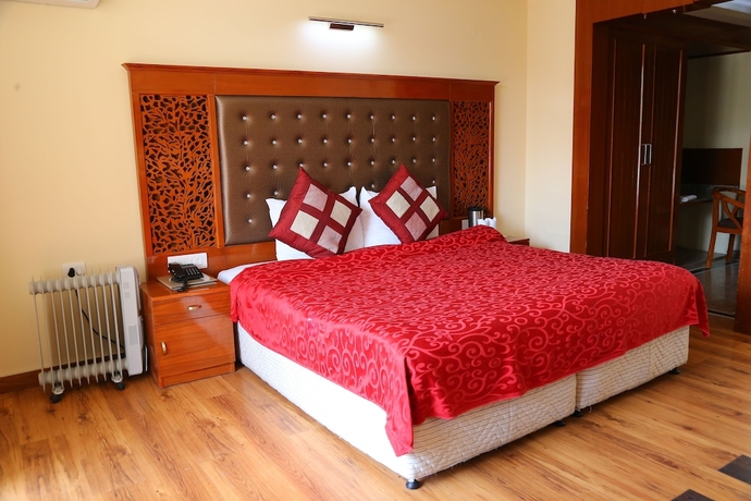 Imagen de la habitación del Hotel Manla Homes Resort. Foto 12