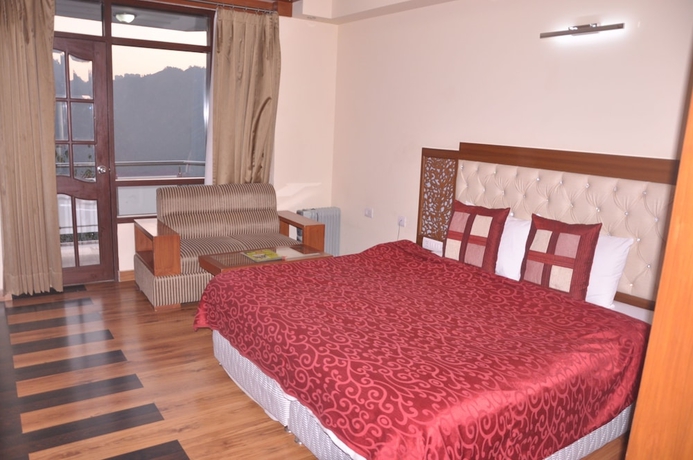 Imagen de la habitación del Hotel Manla Homes Resort. Foto 15