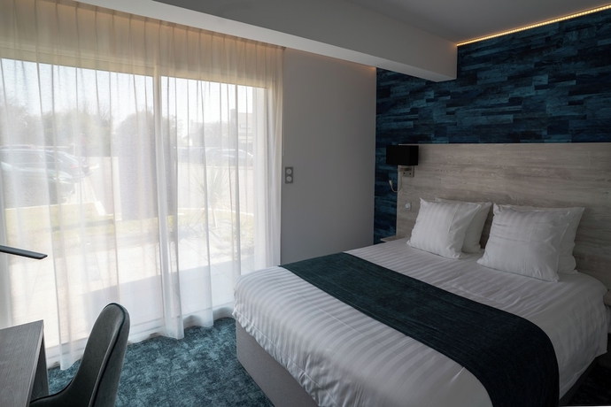 Imagen de la habitación del Hotel Manoir du Roselier. Foto 4