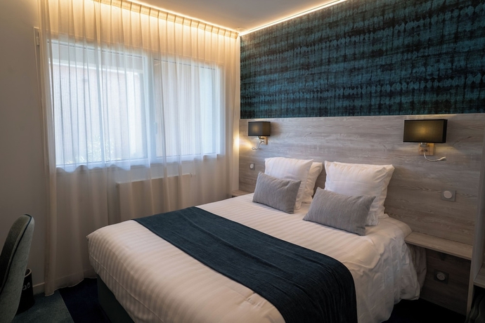 Imagen de la habitación del Hotel Manoir du Roselier. Foto 10