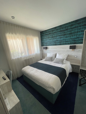 Imagen de la habitación del Hotel Manoir du Roselier. Foto 11