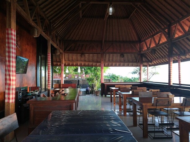 Imagen del bar/restaurante del Hotel Manta Cottage Seaview Plus. Foto 18