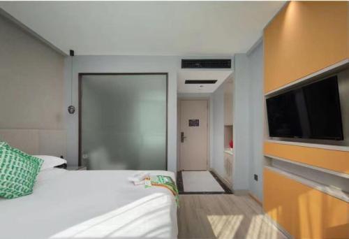 Imagen de la habitación del Hotel Manting City. Foto 16