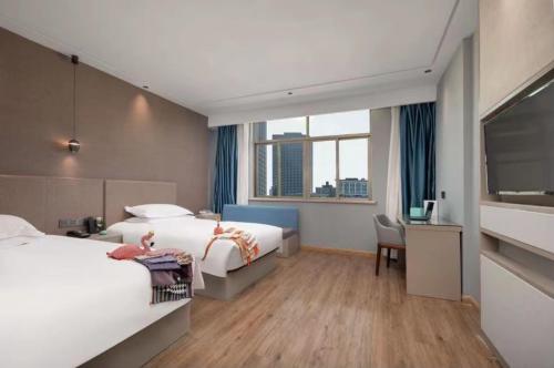 Imagen de la habitación del Hotel Manting City. Foto 18