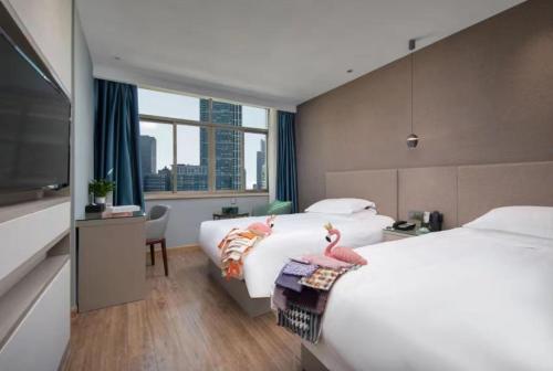 Imagen de la habitación del Hotel Manting City. Foto 19