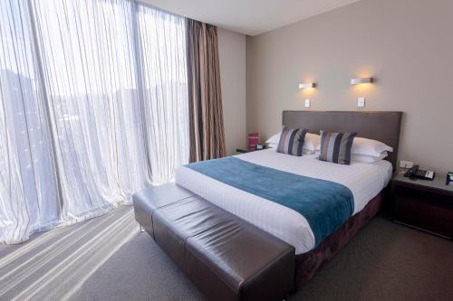 Imagen de la habitación del Hotel Mantra Collins. Foto 16