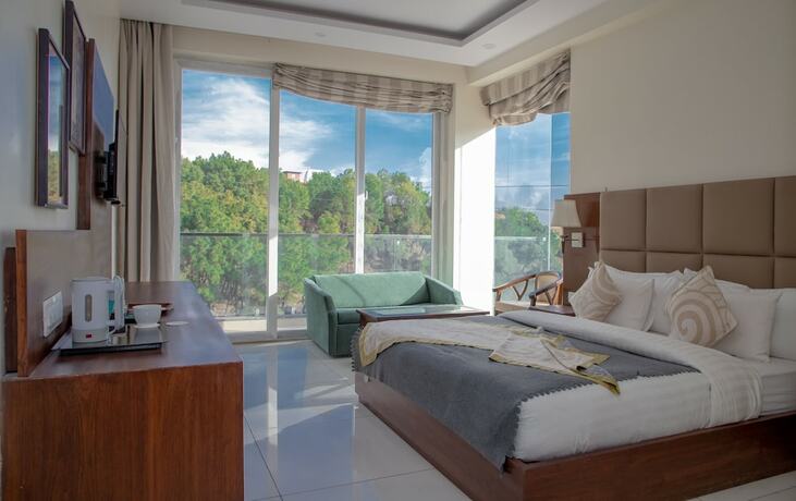 Imagen de la habitación del Hotel Manuni Inn - Riverside. Foto 19